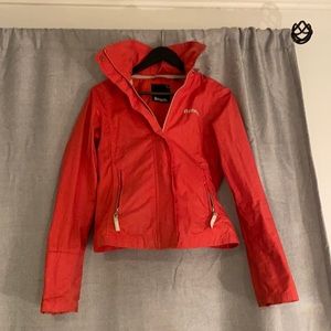 Bench pink jacket. Spring jacket. Has hood and a pocket to stuff it in.